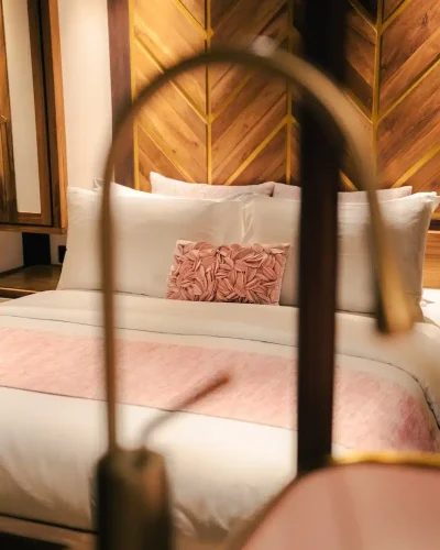Blush-pink themed cabin bed on board Otium, inspired by Pink Beach near Komodo